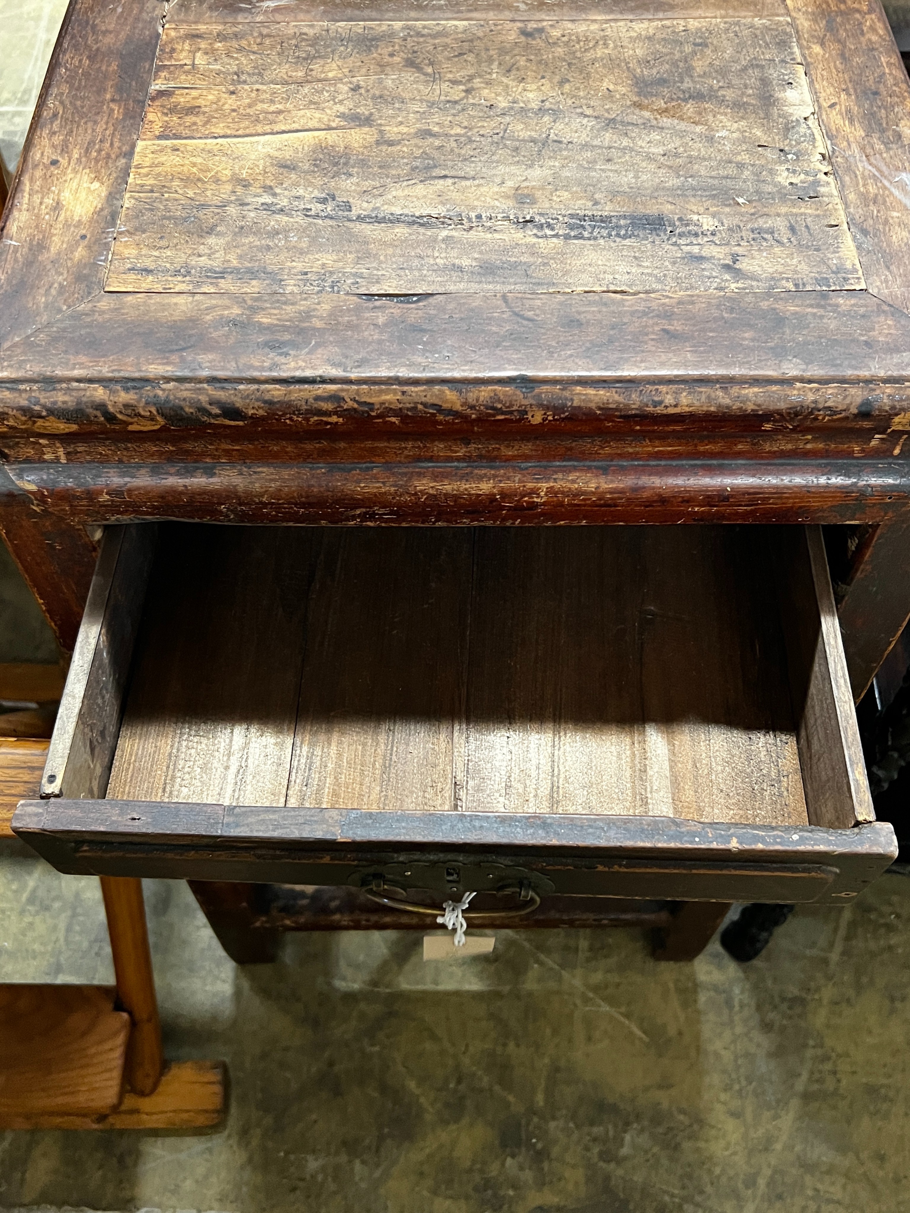 A Chinese lacquered wood three drawer side table, width 43cm, depth 44cm, height 77cm